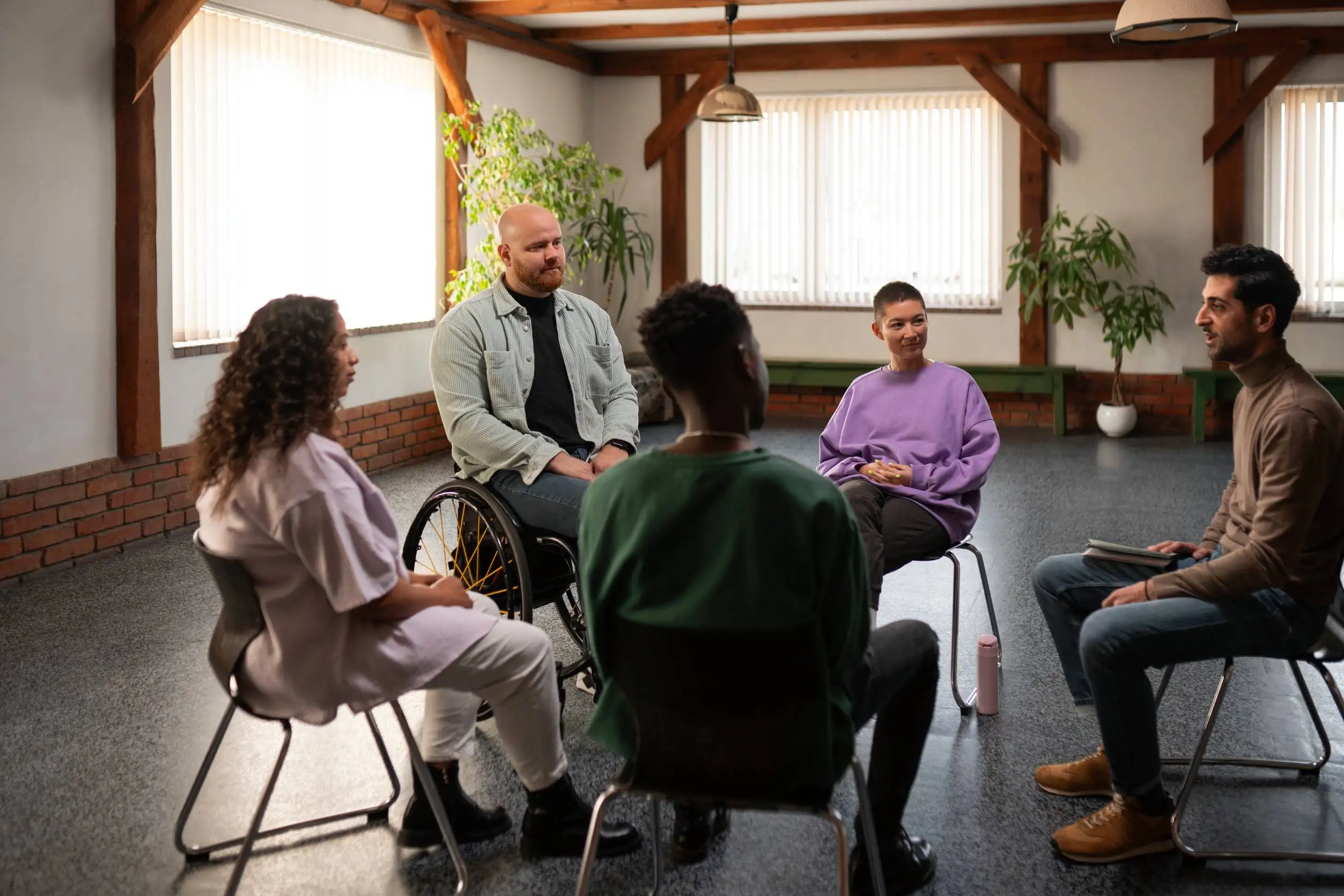 People in a support group meeting