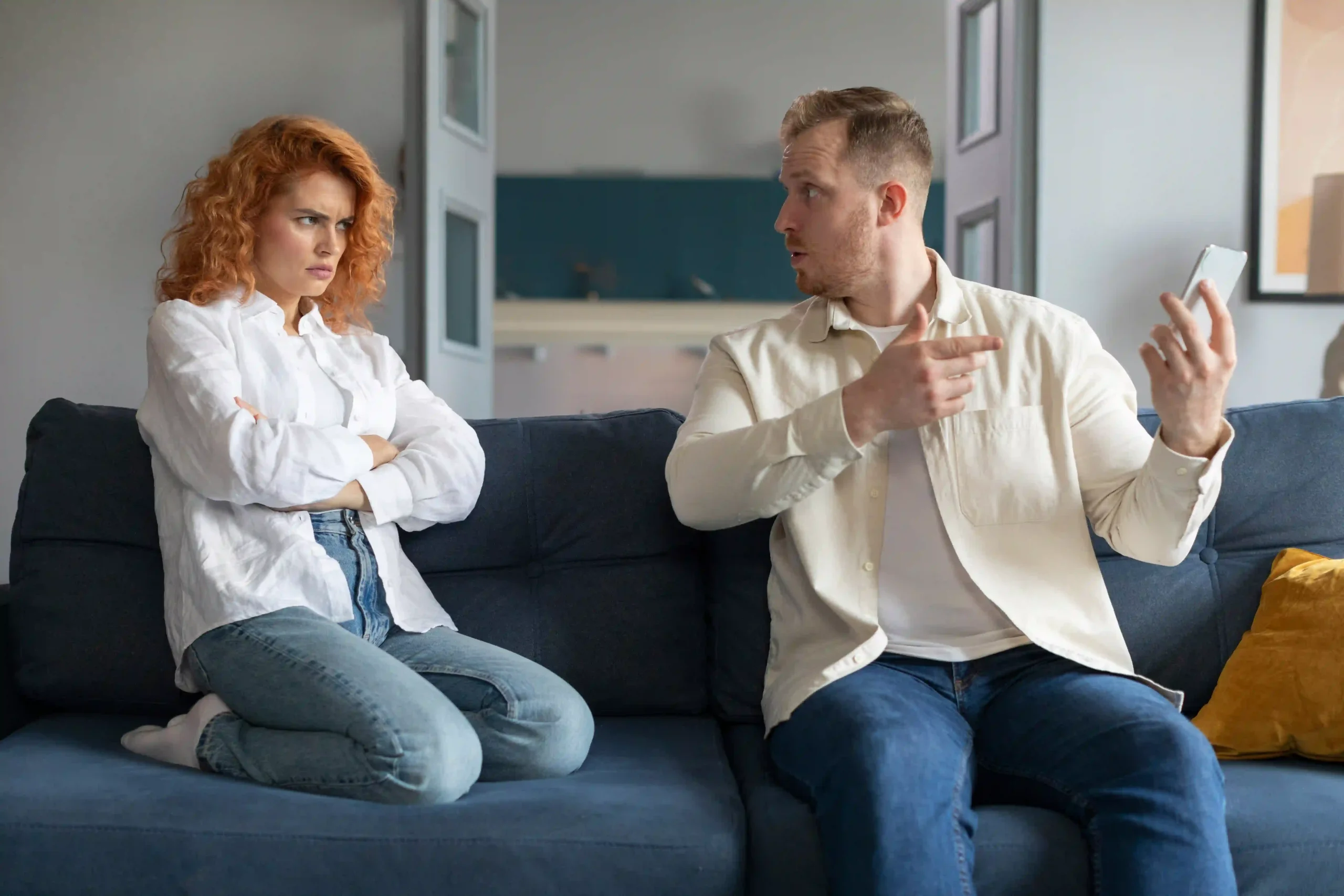 Couple arguing on couch